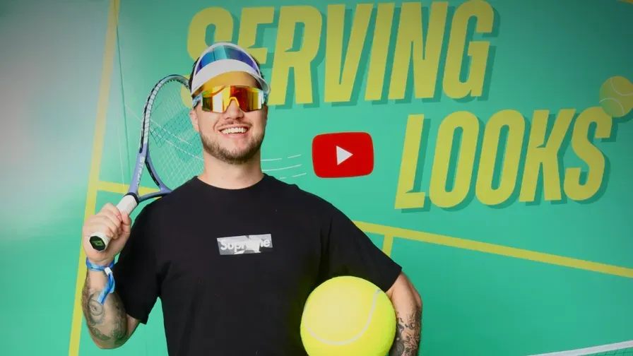 Andrew Bond with a racket at a YouTube tennis event